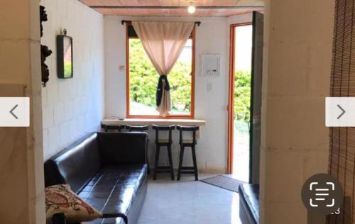 a living room with a couch and a table at Altillo in Salento