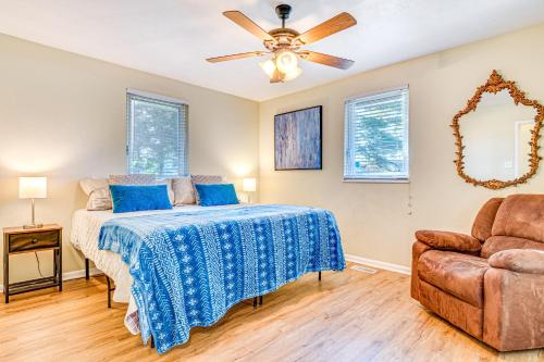 a bedroom with a bed and a ceiling fan at about 10 Mi to Dtwn Indianapolis Home with Game Room! in Indianapolis