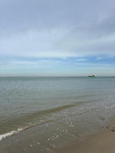a boat in the water on the beach at Neu 6Pers Chalet De Oase Renesse Nordsee in Renesse