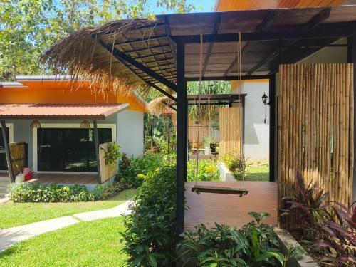 a small house with a thatched roof at Ingtara at Lanta in Ko Lanta