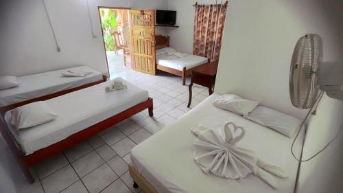 Postel nebo postele na pokoji v ubytování Hotel Ometepetl