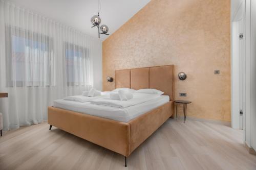a bedroom with a large bed in a room at Villa Delight in Kras