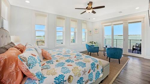 a bedroom with a bed and a view of the ocean at Blue Horizon by Last Key Realty in Sugarloaf Shores