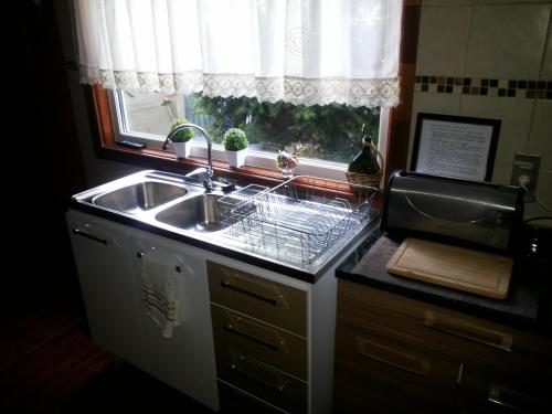 A kitchen or kitchenette at VALYAK rent apart hotel - Servicios Integrales