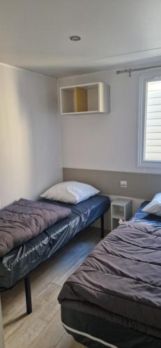 Postel nebo postele na pokoji v ubytování Mobil-home confort 6 personnes proche Europa-Park