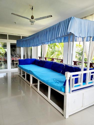 Ένα ή περισσότερα κρεβάτια σε δωμάτιο στο Green Malindi Apartments by RevSerene