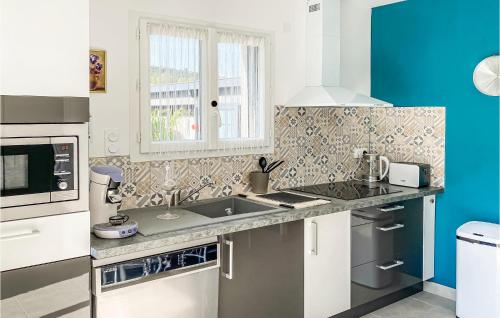 a kitchen with a sink and a window at 2 Bedroom Cozy Home In Saint Chinian in Saint-Chinian