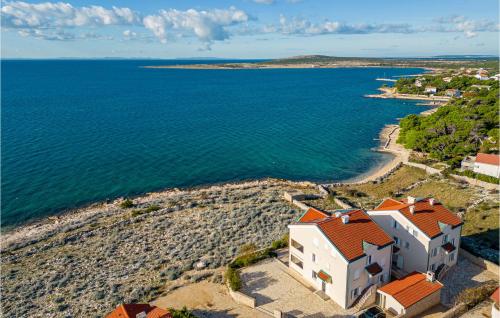 an aerial view of a house on a rocky beach at Vila Sidro in Košljun