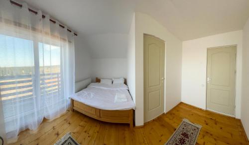 Ένα ή περισσότερα κρεβάτια σε δωμάτιο στο B&C Mountain Retreat