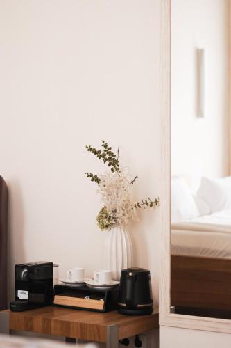 a vase of flowers on a table in a bedroom at Vierzigerhof in Langenlois