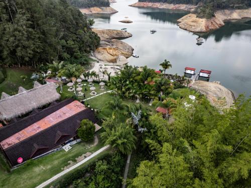 an aerial view of a resort next to a lake at Hotel Pietrasanta in Guatapé