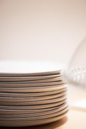 a stack of plates sitting on a table at Vierzigerhof in Langenlois