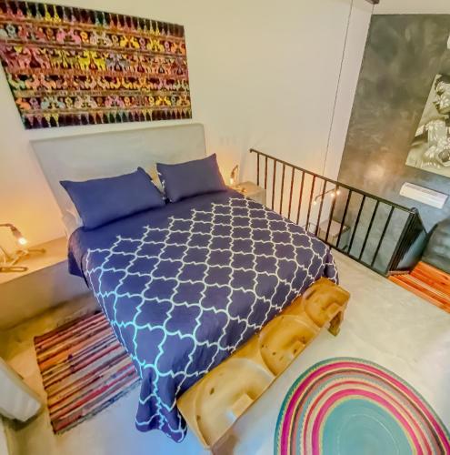 Letto o letti in una camera di Gallo Azul Hotel, en el corazón de Todos Santos