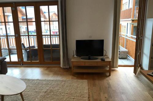 Televízia a/alebo spoločenská miestnosť v ubytovaní Kerstin 3 by SMR Rauris Apartments - inc Spa and near Gondola