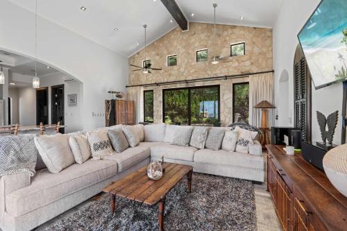 a living room with a large couch and a table at Luxurious 3 Bedroom Villa in Coco