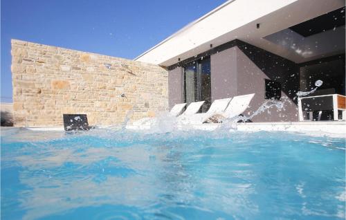 a pool of water in front of a building at Villa K1 in Zadar