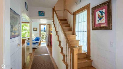 a hallway with a staircase in a home at Casa Serendipity by Last Key Realty in Key West