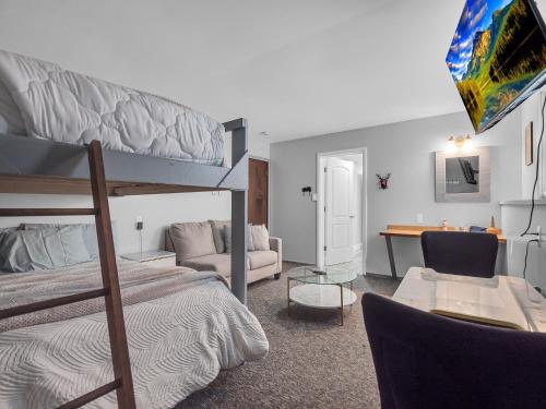 a bedroom with a bunk bed and a desk at Timberline Lodge in Ellicottville
