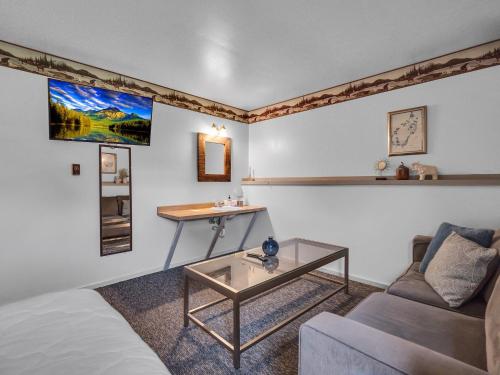 a living room with a couch and a table at Timberline Lodge in Ellicottville