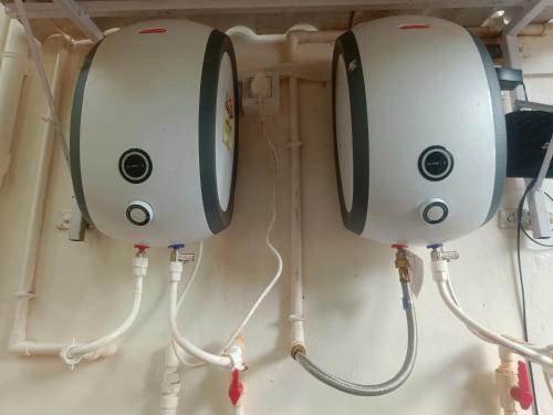 two machines are hooked up to a wall at Shantadurga Beachside Homestay in Guhagar