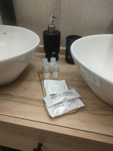 a bathroom counter with a sink and a white bowl at G&S Apartment in Trapani