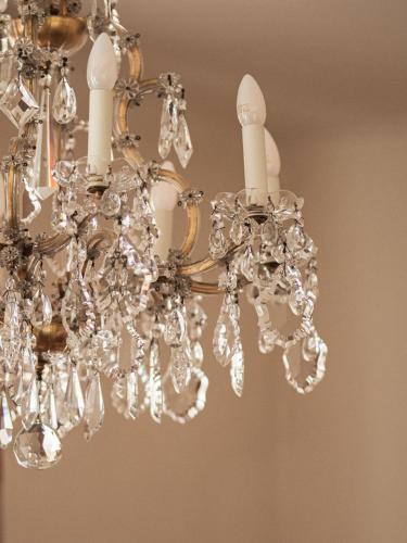 a chandelier with three white candles on it at Vierzigerhof in Langenlois