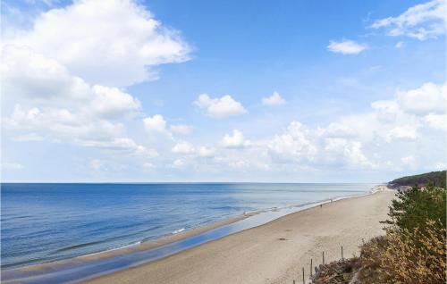 a view of a sandy beach with the ocean at Lovely Home In Zastan With Wifi in Zastań