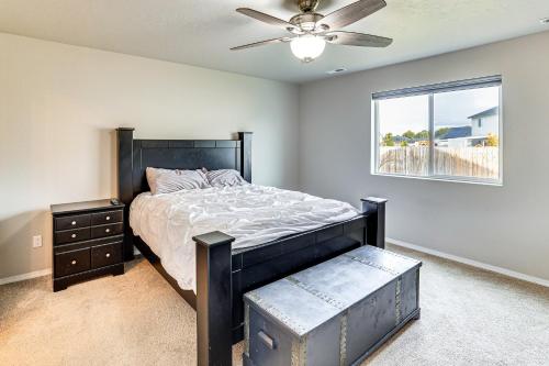 a bedroom with a bed and a ceiling fan at 3 Mi to Lake Lowell Caldwell Home with Yard and Grill in Caldwell