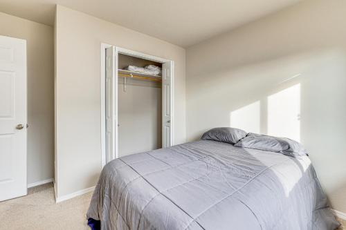a bedroom with a bed and an open door at 3 Mi to Lake Lowell Caldwell Home with Yard and Grill in Caldwell