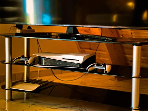 a wooden table with a computer on a shelf at Area36 Family Chalet in Gabala