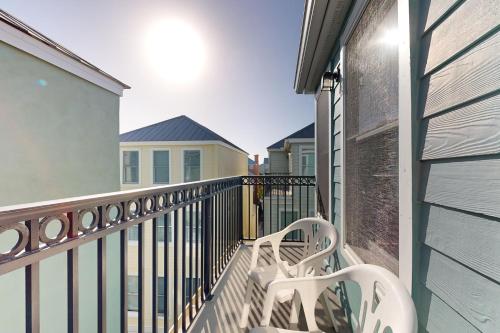 a balcony with two white benches on a building at 126 Grand Pavilion in Isle of Palms