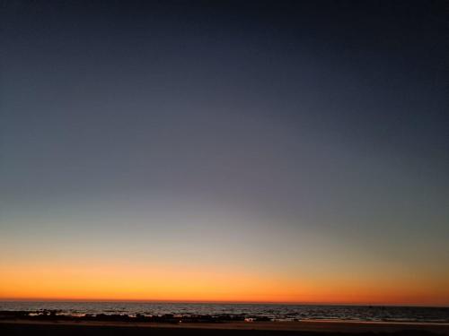 an image of the beach at sunset at Shantadurga Beachside Homestay in Guhagar