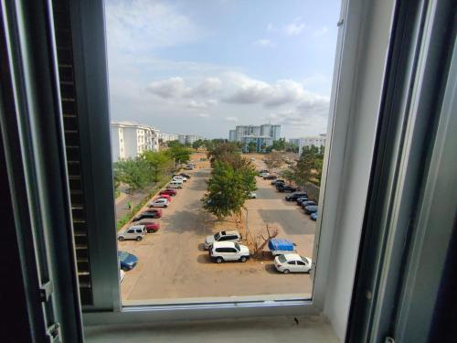 a view from a window of a parking lot at Kilamba Apart VP in Camama