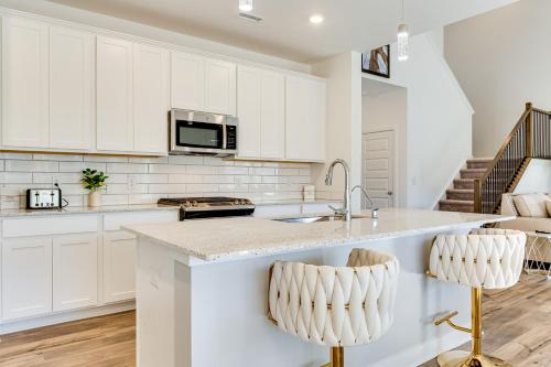 a kitchen with white cabinets and a sink at 4 Mi to Dtwn Danville Home with Patio and Yard in Danville