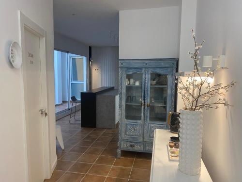 a living room with a blue cabinet and a table at Guest House Espinardo Murcia Casa Universitaria in Murcia
