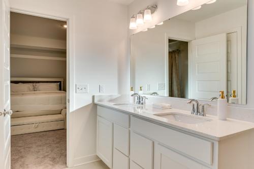 a white bathroom with a sink and a mirror at 4 Mi to Dtwn Danville Home with Patio and Yard in Danville