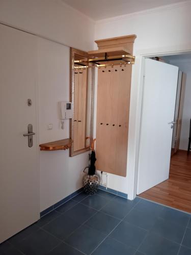 a room with a hallway with a door and a floor at LDL-EXKLUSIv in Bad Camberg