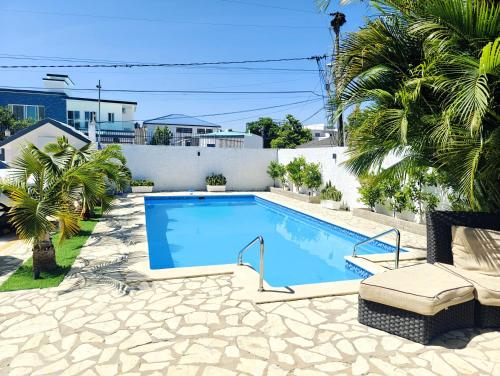 a swimming pool in the backyard of a house at Sosua Sweet Vacations in Sosúa