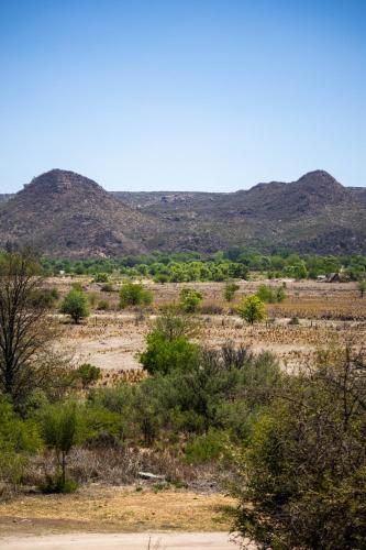 a view of a desert with mountains in the background at Posada de Nono in Nono