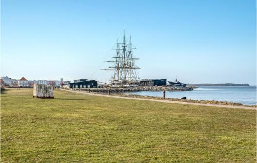 a large ship is docked at a dock at Beautiful Apartment In Ebeltoft in Ebeltoft