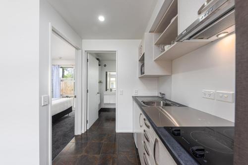 a kitchen with a sink and a counter top at 315 Motel Riccarton in Christchurch