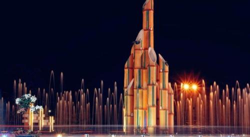 a large building with a clock tower on top of it at Garuda Hotel Pontianak in Pontianak