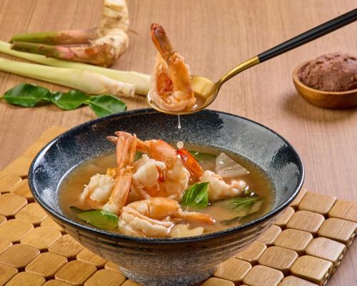 a bowl of shrimp soup with a spoon at Aviyana Hua Hin in Cha Am