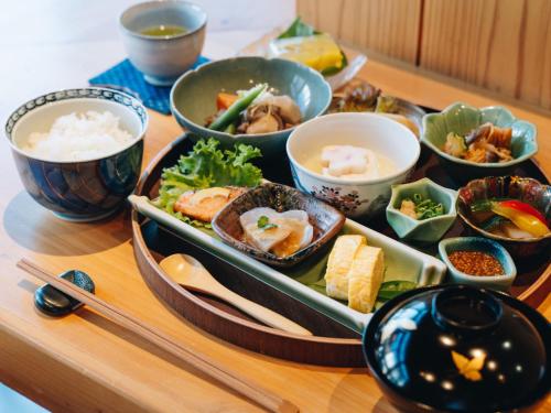 a tray of food on a table with bowls of food at RITA Yame Fukushima in Yame
