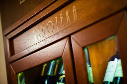 a wooden door with the word hotel on it at Hotel Abácie & Wellness in Valašské Meziříčí