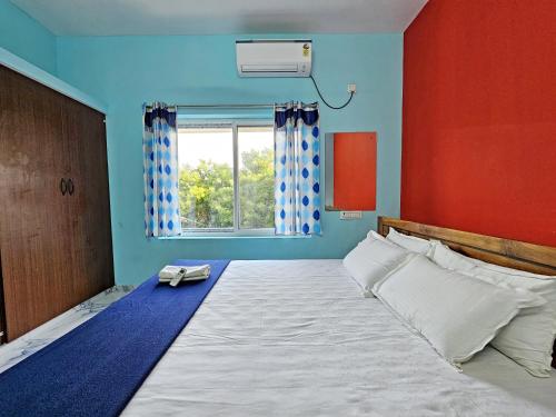 Ένα ή περισσότερα κρεβάτια σε δωμάτιο στο Wom Auro Galaxy