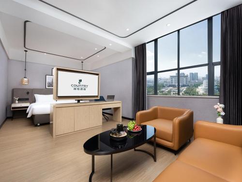 Postel nebo postele na pokoji v ubytování Country Inn & Suites by Radisson Shenzhen International Convention and Exhibition Center