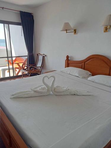 Postel nebo postele na pokoji v ubytování Jansom Beach Resort