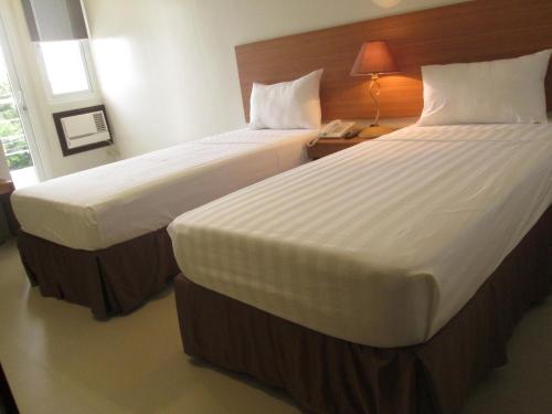 Katil atau katil-katil dalam bilik di Mango Suites - Isabela