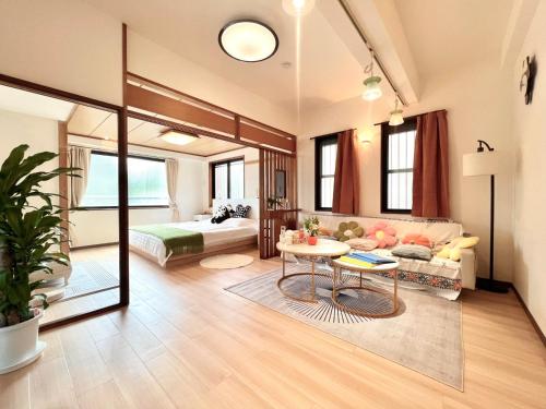 a living room with a couch and a table at ManOku in Tokyo